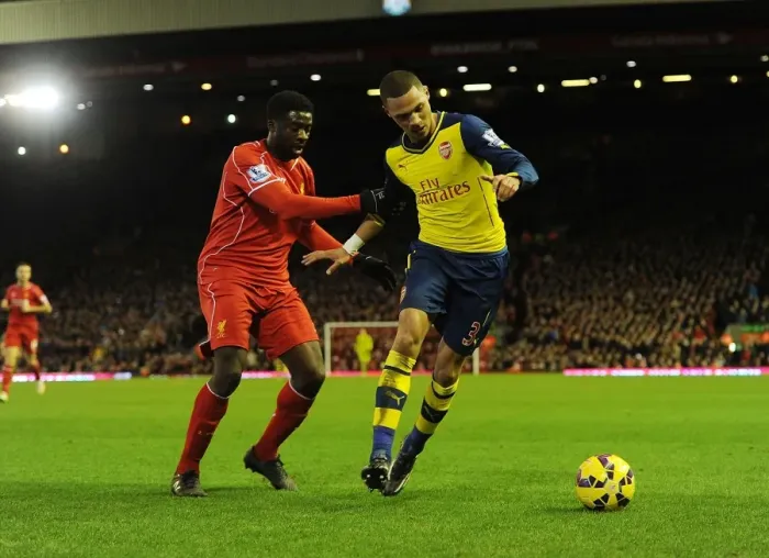 Framed Print : Clash at Anfield: Gibbs vs. Toure - A Premier League Battle