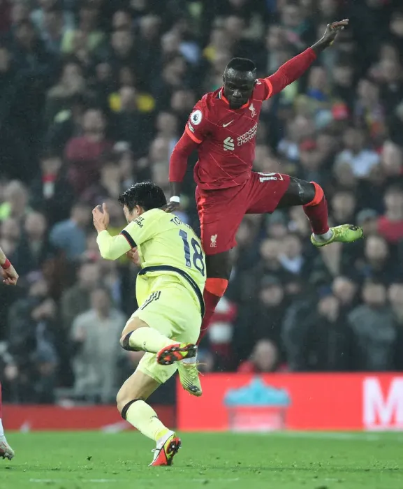 Framed Print : Clash at Anfield: Intense Rivalry - Tomiyasu Fouls Mane (Premier League 2021-22) Framed Print : Clash at Anfield: Intense Rivalry - Tomiyasu Fouls Mane (Premier League 2021-22)