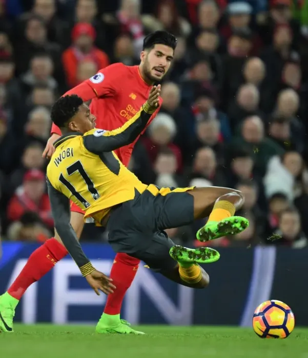 Framed Print : Clash at Anfield: Iwobi Fouls Can in Intense Liverpool vs. Arsenal Premier League Showdown (2016-17) Framed Print : Clash at Anfield: Iwobi Fouls Can in Intense Liverpool vs. Arsenal Premier League Showdown (2016-17)