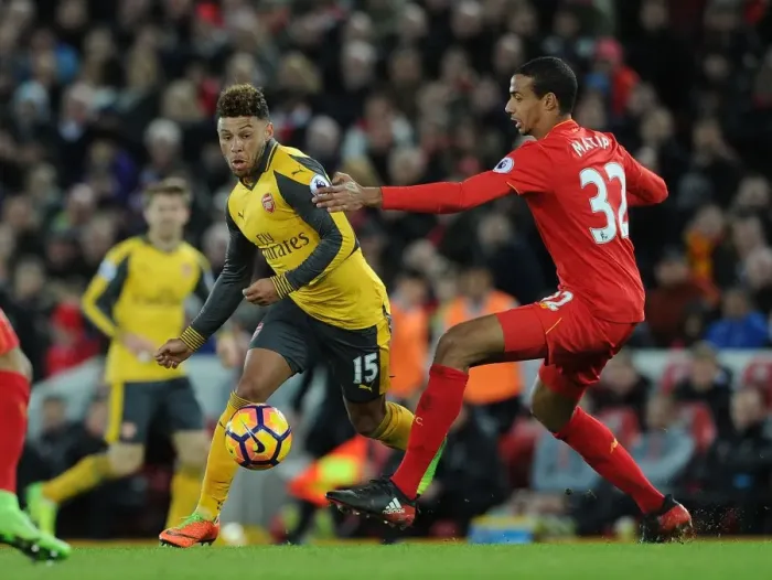 Framed Print : Clash at Anfield: Oxlade-Chamberlain vs. Matip - Premier League Showdown Framed Print : Clash at Anfield: Oxlade-Chamberlain vs. Matip - Premier League Showdown