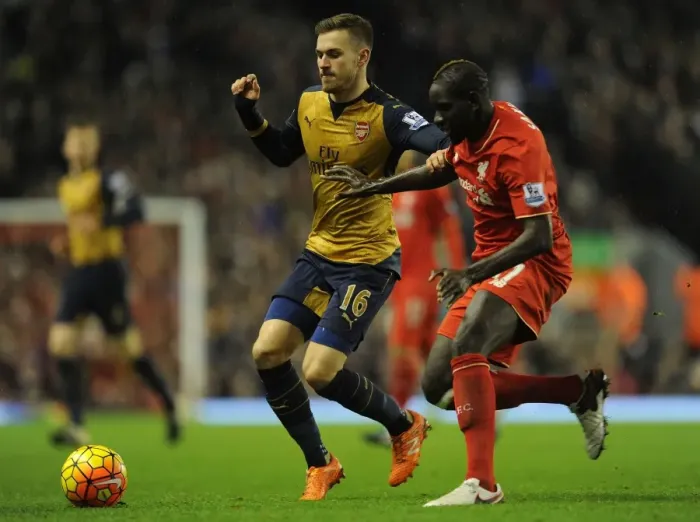 Framed Print : Clash at Anfield: Ramsey vs. Sakho - Premier League 2015-16: Intense Battle Between Arsenal's Ramsey and Liverpool's Sakho Framed Print : Clash at Anfield: Ramsey vs. Sakho - Premier League 2015-16: Intense Battle Between Arsenal's Ramsey and Liverpool's Sakho