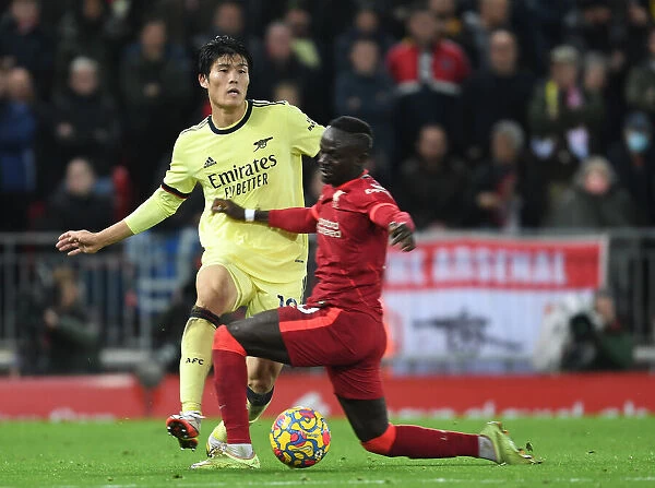 Clash at Anfield: Sadio Mane vs. Takehiro Tomiyasu in the Premier League Showdown between Liverpool and Arsenal