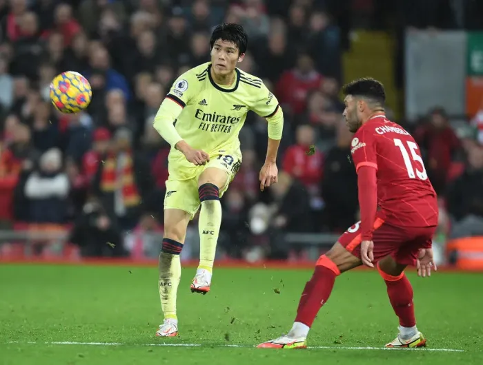 Framed Print : Clash at Anfield: Tomiyasu vs. Oxlade-Chamberlain - Liverpool vs. Arsenal, Premier League 2021-22