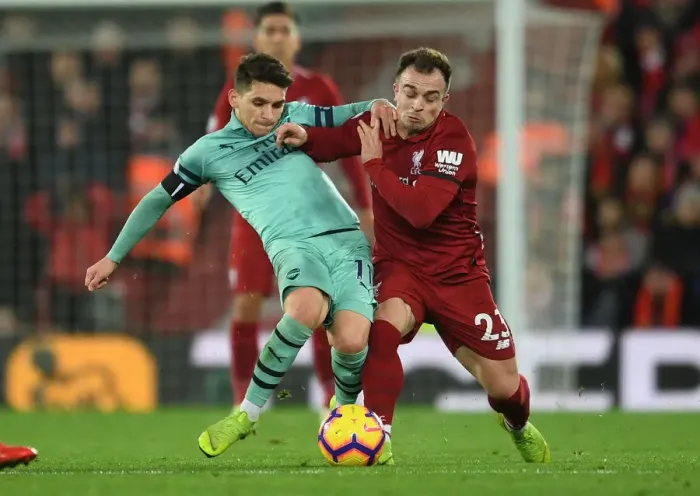 Framed Print : Clash at Anfield: Torreira vs. Shaqiri - Premier League Showdown Framed Print : Clash at Anfield: Torreira vs. Shaqiri - Premier League Showdown