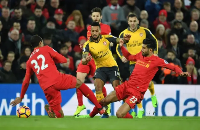 Framed Print : Clash at Anfield: Walcott vs. Matip & Can - Liverpool vs. Arsenal, Premier League 2016-17: Intense Battle Between Theo Walcott and Liverpool's Defense Framed Print : Clash at Anfield: Walcott vs. Matip & Can - Liverpool vs. Arsenal, Premier League 2016-17: Intense Battle Between Theo Walcott and Liverpool's Defense