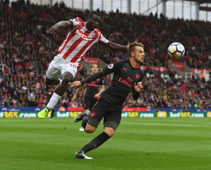Framed Print : Clash at the Bet365: Ramsey vs. Diouf in Stoke-Arsenal Premier League Showdown Framed Print : Clash at the Bet365: Ramsey vs. Diouf in Stoke-Arsenal Premier League Showdown