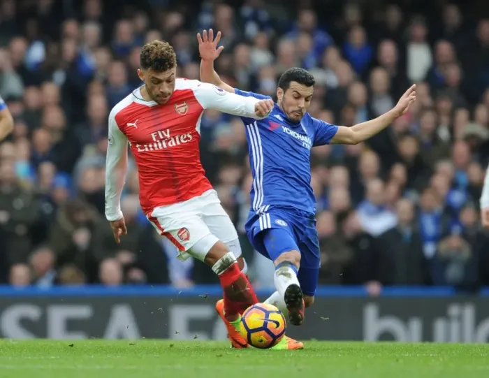 Framed Print : Clash of the Blues: Oxlade-Chamberlain vs Pedro - Intense Rivalry in the Premier League (Arsenal vs Chelsea, 2016-17) Framed Print : Clash of the Blues: Oxlade-Chamberlain vs Pedro - Intense Rivalry in the Premier League (Arsenal vs Chelsea, 2016-17)