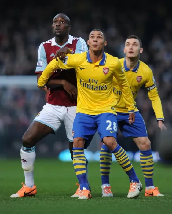 Framed Print : Clash at Boleyn Ground: Kieran Gibbs vs. Carlton Cole - Arsenal vs. West Ham United, Premier League (December 2013)