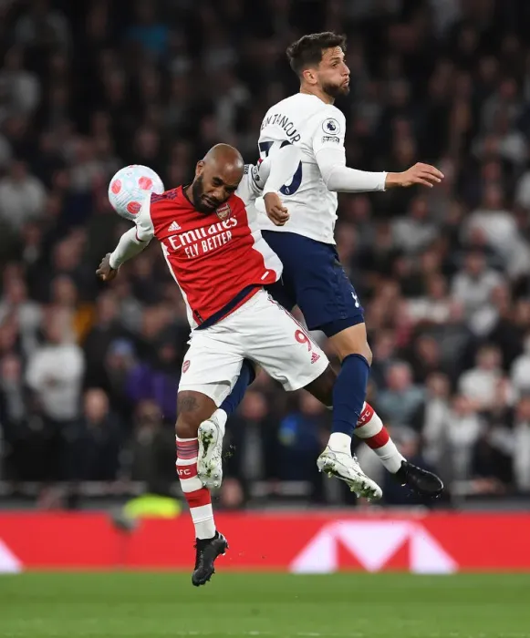 Framed Print : Clash of the Capital Rivals: Lacazette vs. Bentancur in the Premier League Showdown between Tottenham and Arsenal
