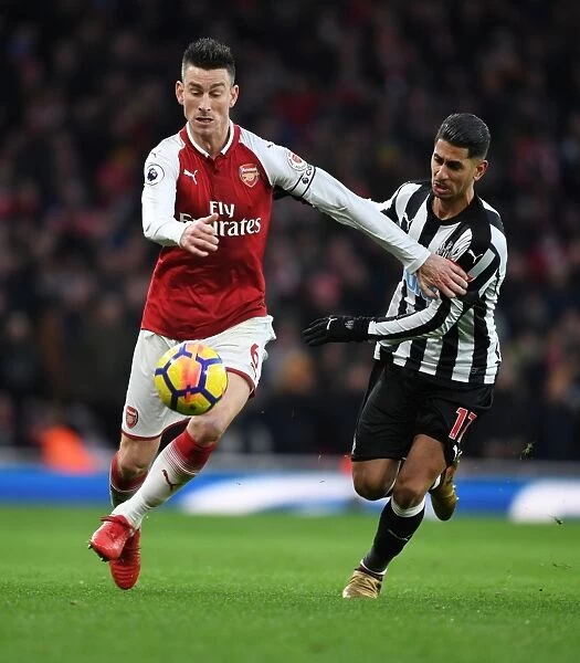 Clash of Champions: Koscielny vs. Perez in Arsenal's Battle Against Newcastle