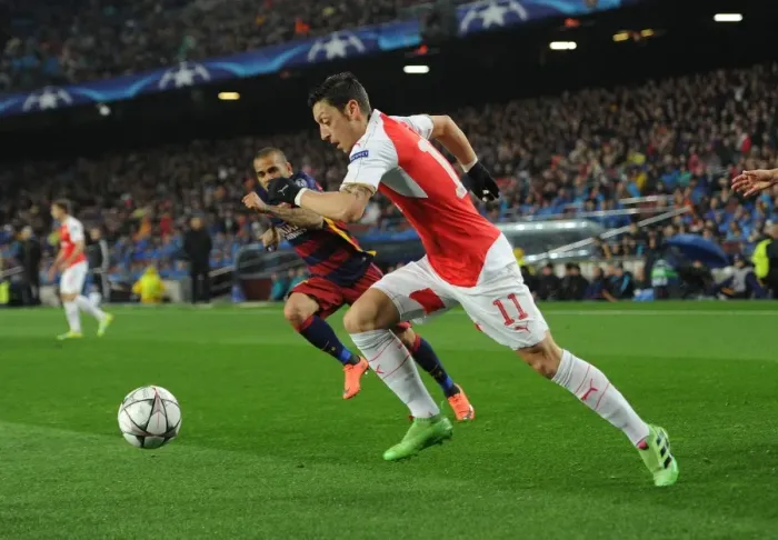 Framed Print : Clash of Champions League Titans: Mesut Ozil vs Dani Alves