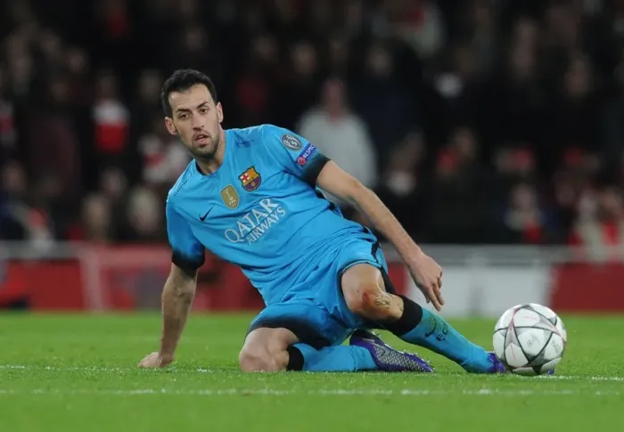 Framed Print : Clash of Champions League Titans: Sergio Busquets Focus Amidst Intense Arsenal vs. Barcelona Rivalry (2016)