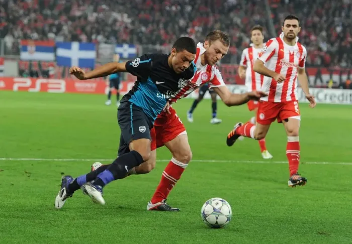 Framed Print : Clash of Champions: Oxlade-Chamberlain vs. Papadopoulos - Olympiacos vs. Arsenal, UEFA Champions League (December 2011)