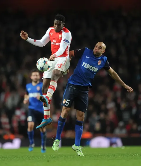 Framed Print : Clash of Champions: Welbeck vs Abdennour in Arsenal's Battle Against Monaco