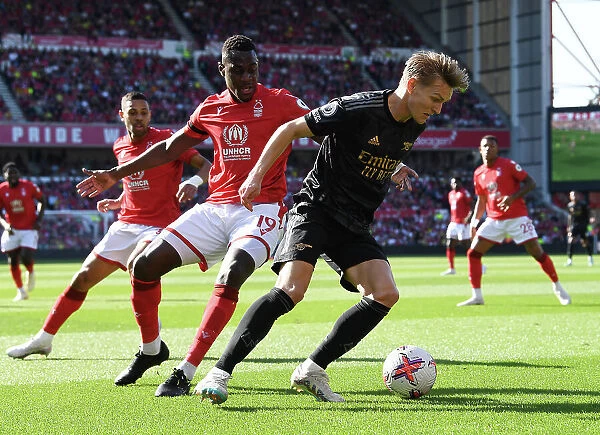 Clash at the City Ground: Arsenal's Martin Odegaard Faces Off Against Nottingham Forest's Moussa Niakhate