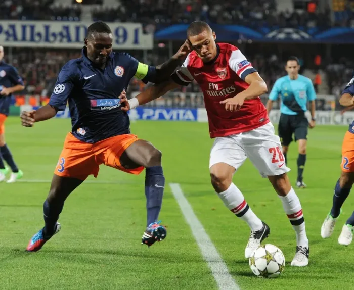 Framed Print : Clash of Defenders: Gibbs vs. Yanga-Mbiwa - Montpellier vs. Arsenal, UEFA Champions League, 2012