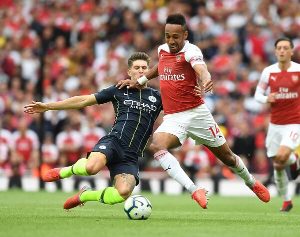 Clash at the Emirates: Aubameyang vs. Stones in Arsenal's Battle Against Manchester City