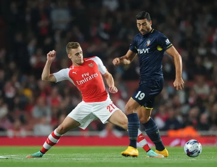 Framed Print : Clash at the Emirates: Chambers vs. Pelle in the League Cup Battle