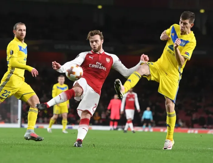 Framed Print : Clash at Emirates: Chambers vs. Stasevich in Arsenal's Europa League Battle Framed Print : Clash at Emirates: Chambers vs. Stasevich in Arsenal's Europa League Battle