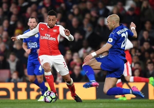 Clash at the Emirates: Coquelin vs Benalouane in Arsenal's Battle Against Leicester