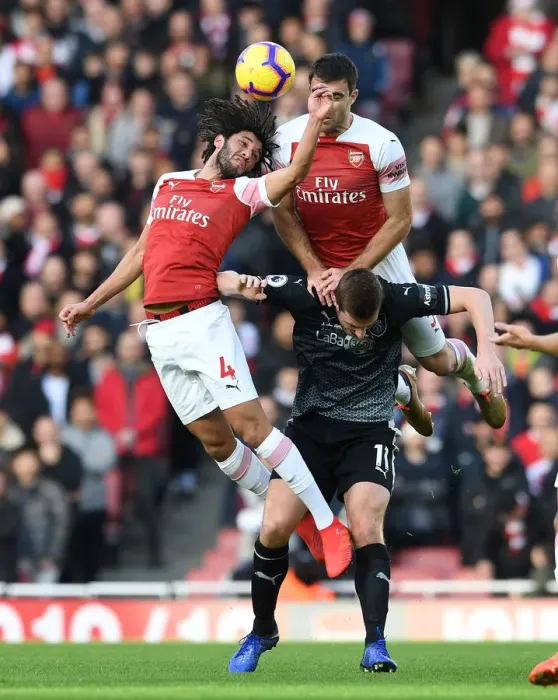 Framed Print : Clash at Emirates: Elneny and Sokratis Go Head-to-Head Against Wood