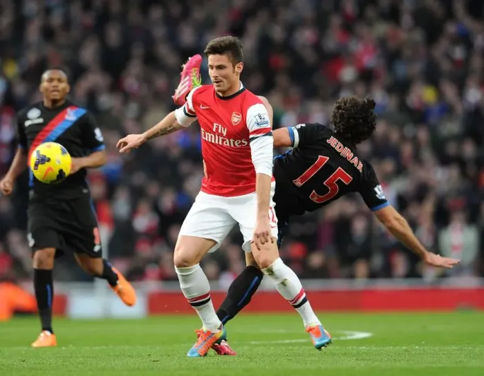 Framed Print : Clash at Emirates: Giroud vs Jedinak in Arsenal's Battle Against Crystal Palace