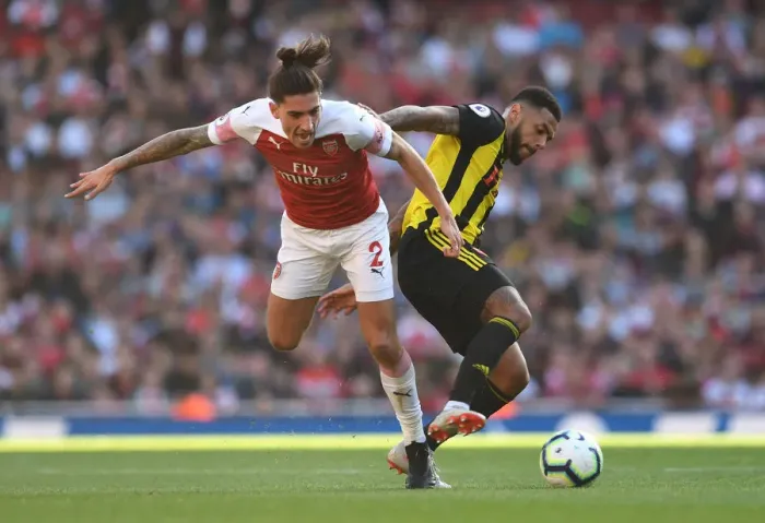 Framed Print : Clash at the Emirates: Hector Bellerin vs. Andre Gray in Arsenal's Battle Against Watford