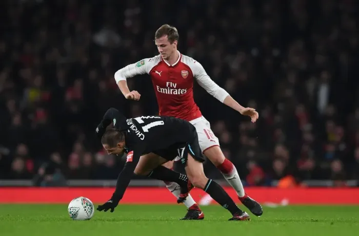Framed Print : Clash at the Emirates: Holding vs. Hernandez in the Carabao Cup Quarterfinals
