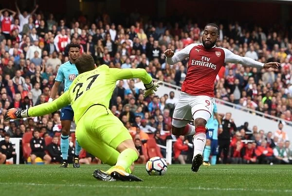 Clash at the Emirates: Lacazette Challenges Begovic in Arsenal vs. AFC Bournemouth