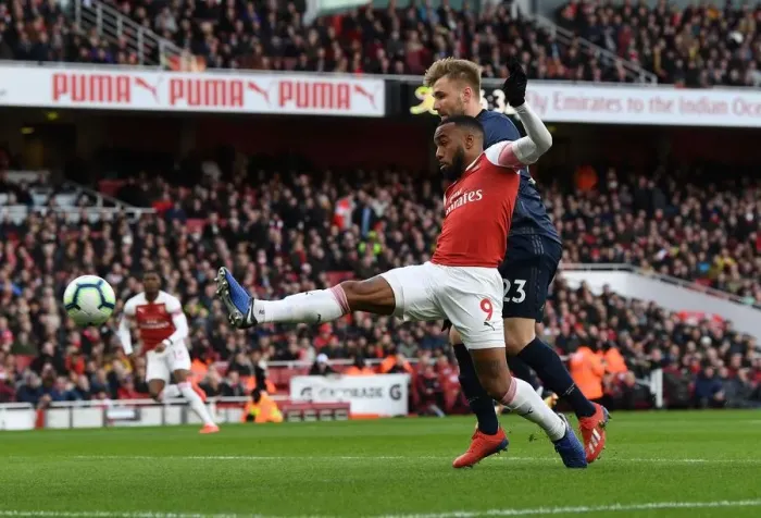 Framed Print : Clash at the Emirates: Lacazette vs Shaw in Arsenal's Battle Against Manchester United Framed Print : Clash at the Emirates: Lacazette vs Shaw in Arsenal's Battle Against Manchester United