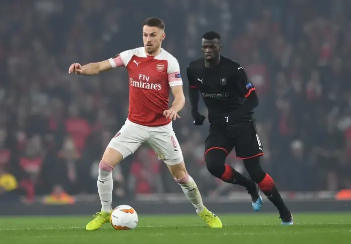Framed Print : Clash at Emirates: Ramsey vs. Niang in Europa League Showdown Framed Print : Clash at Emirates: Ramsey vs. Niang in Europa League Showdown