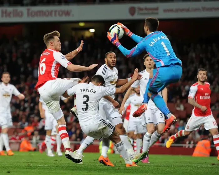 Framed Print : Clash at Emirates: Ramsey's Intense Tackle vs. Taylor and Fabianski (Arsenal vs. Swansea, 2014 / 15)