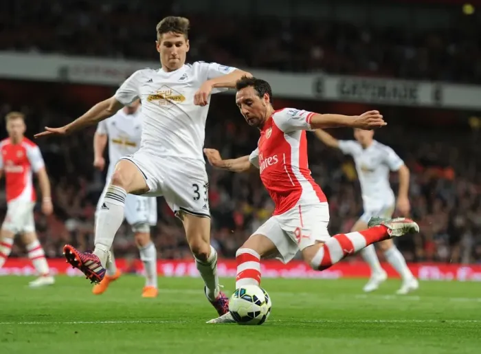 Framed Print : Clash at Emirates: Santi Cazorla vs Federico Fernandez - A Battle of Midfielders