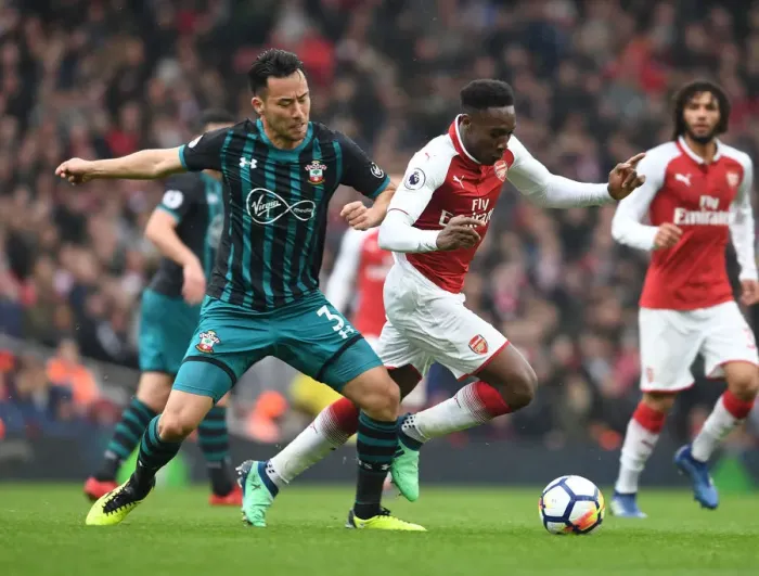 Framed Print : Clash at Emirates: Welbeck vs Yoshida in Arsenal vs Southampton Premier League Battle
