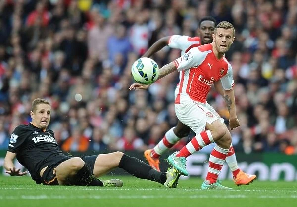 Clash at Emirates: Wilshere vs Dawson in Arsenal's Battle against Hull City (2014-15)