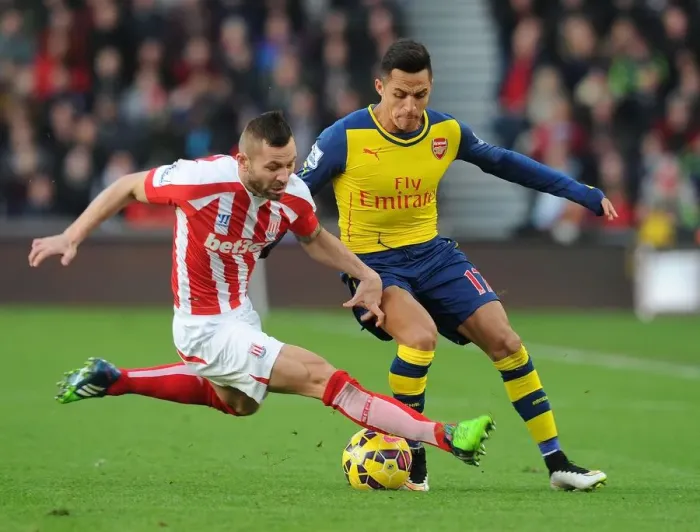 Framed Print : Clash of Forces: Sanchez vs. Bardsley - Stoke City vs. Arsenal, Premier League, 2014