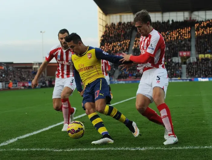 Framed Print : Clash of Forces: Sanchez vs Pieters & Muniesa - Arsenal's Star Forward Battles Stoke's Defenders (2014-15) Framed Print : Clash of Forces: Sanchez vs Pieters & Muniesa - Arsenal's Star Forward Battles Stoke's Defenders (2014-15)