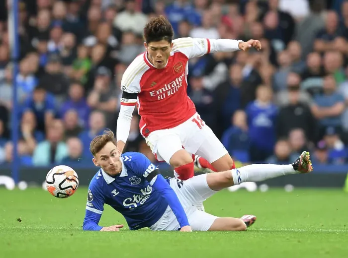 Framed Print : Clash at Goodison Park: Arsenal's Tomiyasu Faces Off Against Everton's Garner (2023-24)