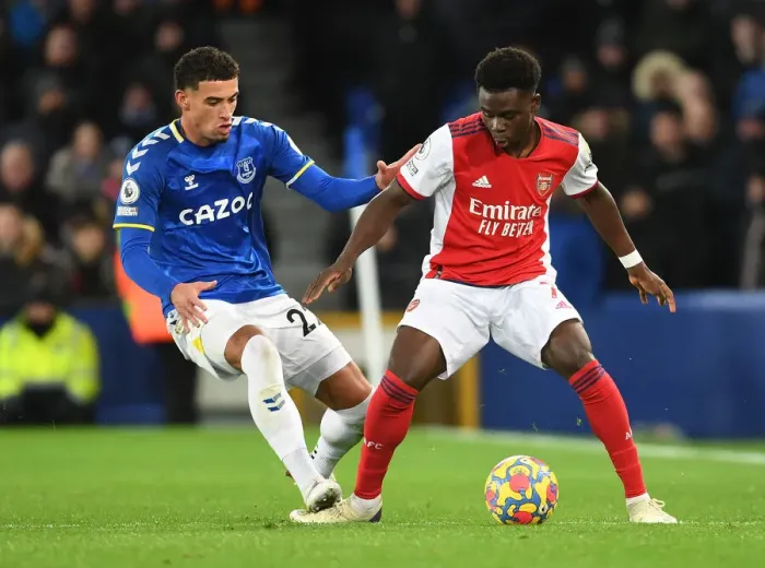 Framed Print : Clash at Goodison Park: Bukayo Saka vs Ben Godfrey in Everton vs Arsenal Premier League Showdown