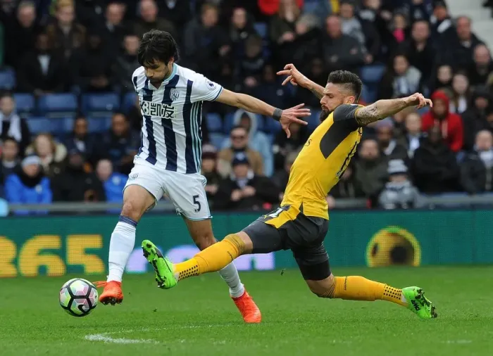 Framed Print : Clash at The Hawthorns: Giroud vs. Yacob in Arsenal's Premier League Battle with West Bromwich Albion Framed Print : Clash at The Hawthorns: Giroud vs. Yacob in Arsenal's Premier League Battle with West Bromwich Albion
