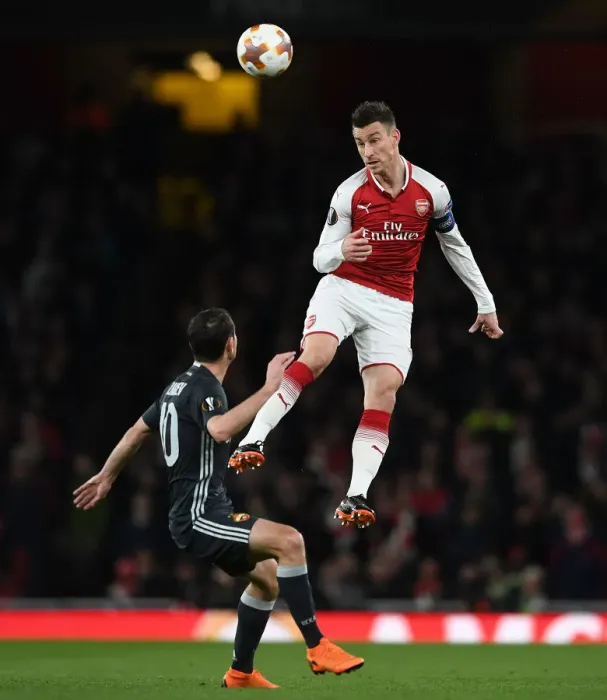 Framed Print : Clash of Heads: Koscielny vs. Dzagoev - Arsenal's Europa League Battle (Arsenal v CSKA Moscow 2017-18)