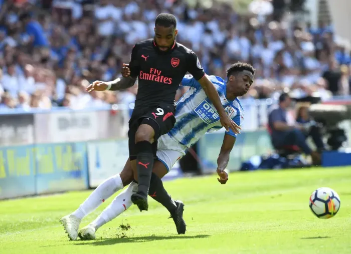 Framed Print : Clash at John Smiths: Lacazette vs. Kongolo in Premier League Showdown Framed Print : Clash at John Smiths: Lacazette vs. Kongolo in Premier League Showdown