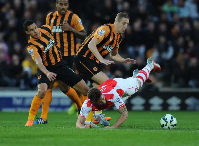 Framed Print : Clash at KC Stadium: Olivier Giroud vs. Hull City's Jake Livermore and Michael Dawson