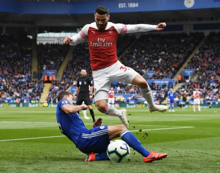 Framed Print : Clash at The King Power: Evans vs. Kolasinac - A Premier League Battle Framed Print : Clash at The King Power: Evans vs. Kolasinac - A Premier League Battle