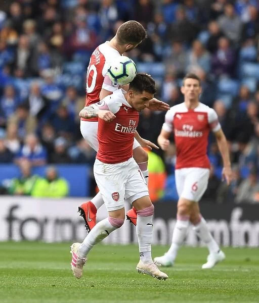 Clash at The King Power: Mustafi and Torreira Battle for the Ball in Leicester City vs Arsenal FC