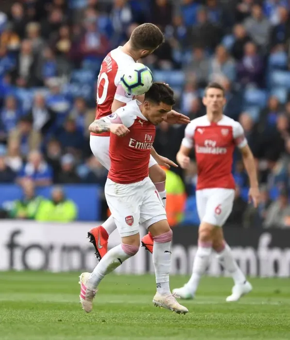 Framed Print : Clash at The King Power: Mustafi and Torreira Battle for the Ball in Leicester City vs Arsenal FC