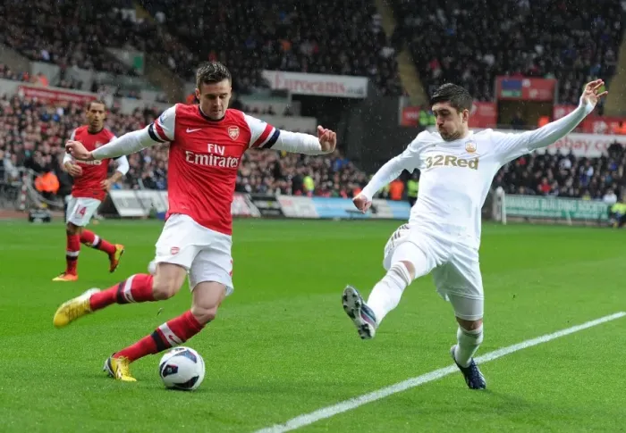 Framed Print : Clash at Liberty: Jenkinson vs. Davies - A Premier League Battle
