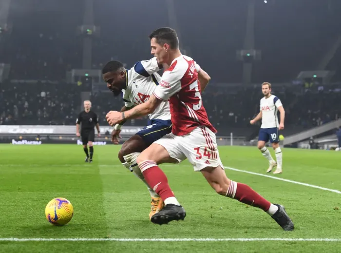 Framed Print : Clash of the London Rivals: Xhaka vs. Aurier - Battle at the Tottenham Hotspur Stadium
