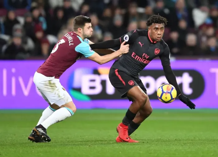 Framed Print : Clash at London Stadium: Iwobi vs Cresswell in the Premier League Battle between West Ham and Arsenal Framed Print : Clash at London Stadium: Iwobi vs Cresswell in the Premier League Battle between West Ham and Arsenal