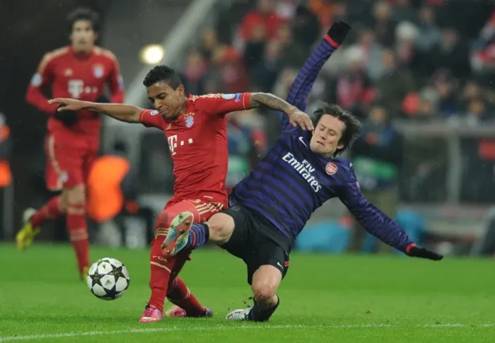 Framed Print : Clash of Midfield Giants: Rosicky vs. Gustavo in Bayern Munich vs. Arsenal UEFA Champions League Showdown